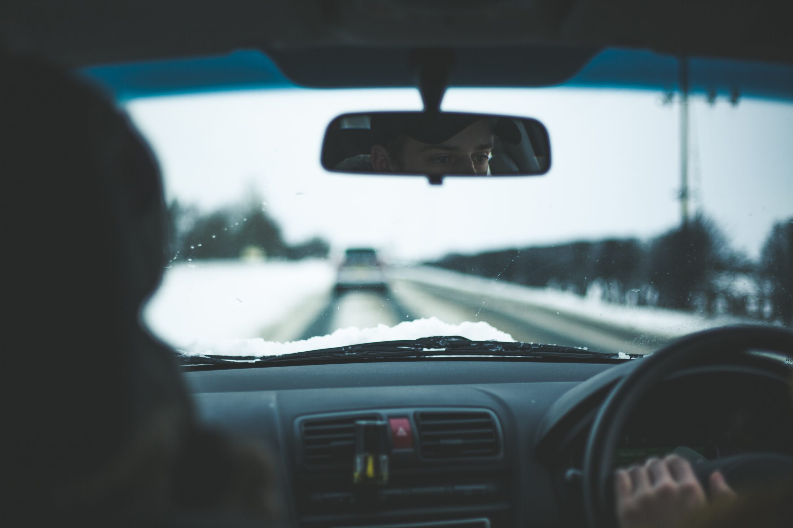 Inside of a car on a snowy road